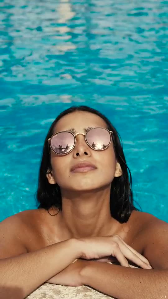 Poolside sunglasses, stock footage
